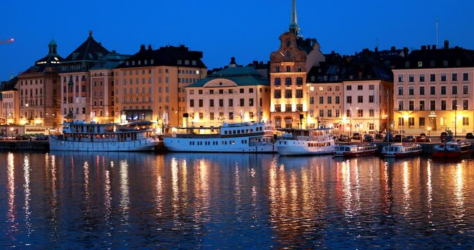 Stockholm, Sweden. Scenic Night View Of Embankment In Old Town Of Stockholm At Summer. Gamla Stan In Summer Evening. Famous Popular Destination Scenic Place And UNESCO World Heritage Site