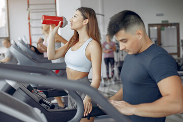 Fototapeta premium Young sports people training in a morning gym