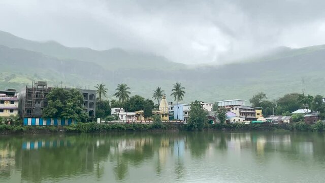 Distant View Of Shri Gaytridevi Mandir Temple During Cloudy Day At Trimbak City, Maharashtra, India. wide shot