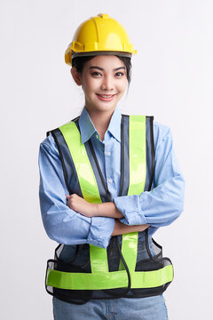beautiful young asian woman engineer and safety helmet on white background, construction concept, Engineer, Industry.