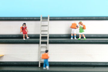 Compose a ladder-shaped book and a doll model of children playing on it