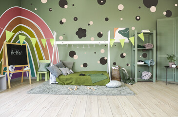 Obraz premium Interior of modern children's room with comfortable bed and beautiful painting on wall