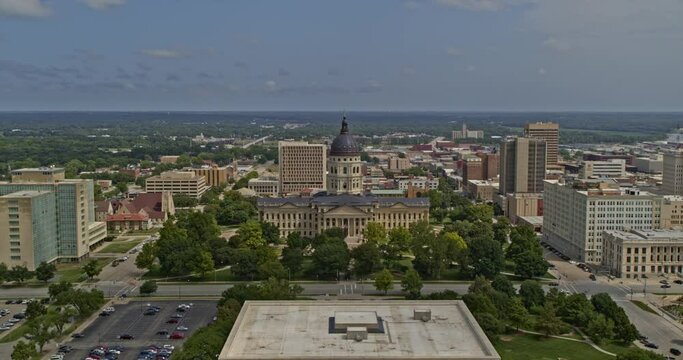 Topeka Kansas push in aerial shot past the Capitol Building and the Statue of the Archer - 6k footage - August 2020