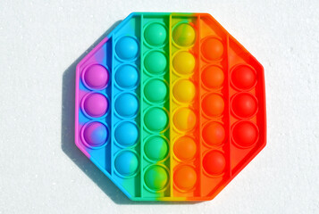 Finger colorful polygon poppit game. Silicone Tie-dye Push pop Bubble isolated on white background
