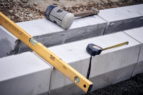 Spirit level and tools on a contruction site.