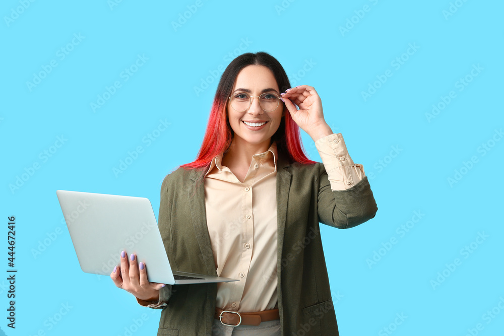 Poster female programmer with laptop on color background