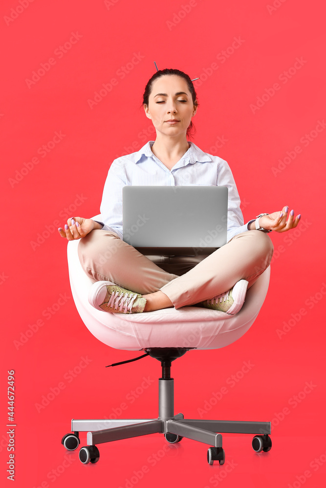 Poster female programmer with laptop meditating on color background