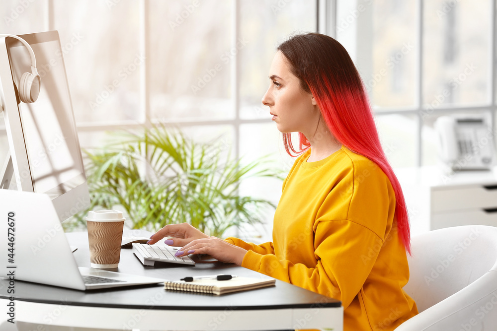 Poster female programmer working with computer in office