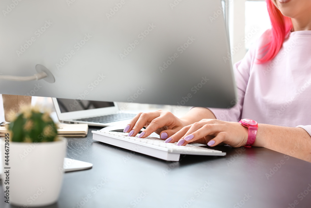 Poster female programmer working with computer in office, closeup