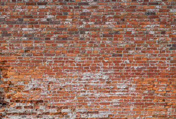 Front view of old and weathered red brick wall. Abstract full frame textured background.