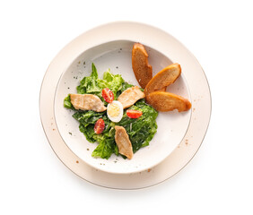 Plate with Caesar salad on white background