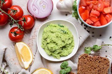 Composition with tasty guacamole on light wooden background