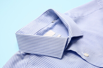 Stylish male shirt on color background, closeup