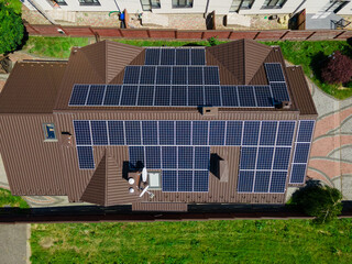 aerial view of house building with solar sun panels