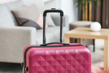 Packed suitcase in living room