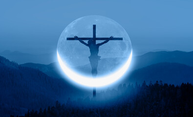 Fototapeta na wymiar Beautiful landscape with blue misty silhouettes of mountains and crescent moon Jesus christ in the foreground