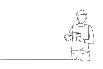 Single continuous line drawing handsome male pouring orange juice into glass from bottle while having breakfast at home. Healthy lifestyle concept. One line draw graphic design vector illustration