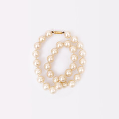 Pearl precious necklace isolated on white background