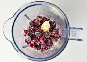 food blender jug with frozen fruit for smoothie making 