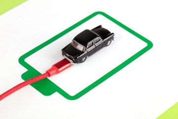 Car model charging concept on battery symbol