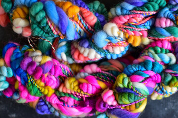 Obraz na płótnie Canvas colourful art yarn backdrop for knitting or crochet 