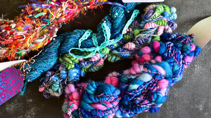 colourful art yarn wrapped in lace ribbon 