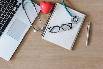 Top View of Doctor Workspace With Stethoscope and Personal Equipment on Table Desk, Above View of Doctor Working Space at Clinic Hospital. Health Medical Occupation and Business Healthcare Concept