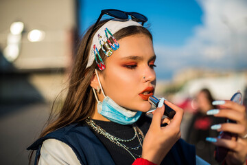 Beautiful country girl in 90s style 80s. Stylish portrait of cute teenage girl in retro colourful...
