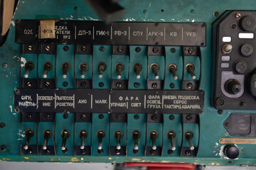 Toggle switches old soviet helicopter mi2 many text Russian language which translates Light danger...
