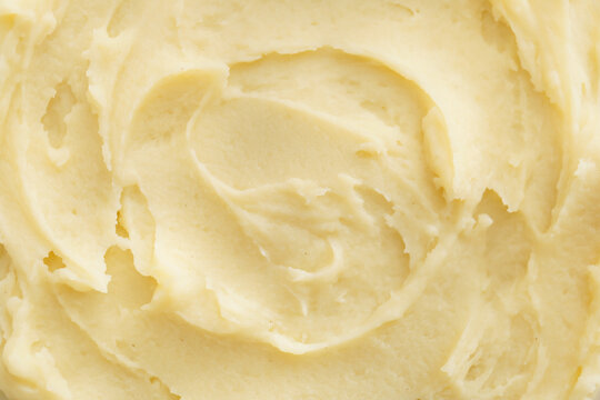 Tasty mashed potatoes as background, closeup