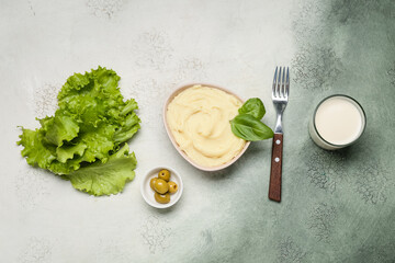Composition with tasty mashed potatoes on grunge background