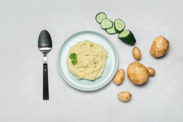 Composition with tasty mashed potatoes on light background