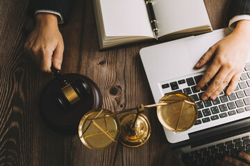 Business and lawyers discussing contract papers with brass scale on desk in office. Law, legal services, advice, justice and law concept picture with film grain effect