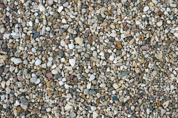 Small multi-colored stones as background. Abstract natural texture.