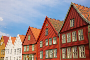 Fototapeta na wymiar Colourful wooden houses of Bryggen the old wharf historic harbour district of Bergen, Norway. Its a Unesco World heritage listed and was rebuilt after being destroyed in a fine.