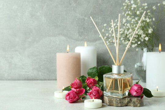Aromatic concept with diffuser, flowers and candles