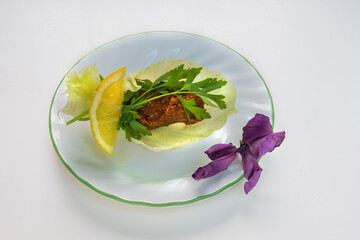 A traditional Turkish dish made by kneading bulgur, minced meat and spices. Raw Meatballs