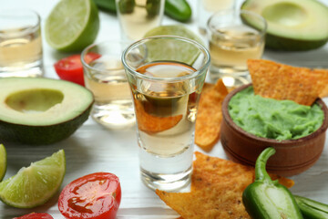 Party concept with tequila, guacamole and chips