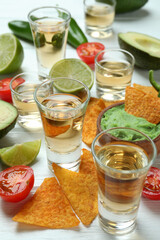 Party concept with tequila, guacamole and chips
