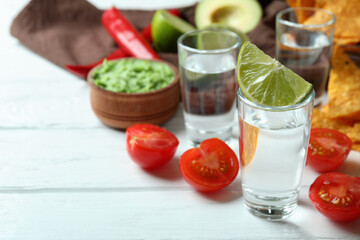 Party concept with tequila, guacamole and chips