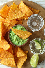 Party concept with tequila, guacamole and chips