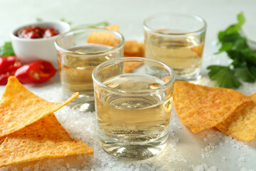 Party concept with tequila, guacamole and chips