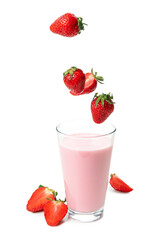 Glass of strawberry milkshake and falling strawberries isolated on white background
