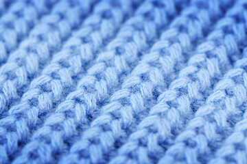 Knitting blue background - macrophotography, top view 