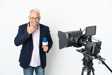 Reporter Middle age Brazilian man holding a microphone and reporting news isolated on white background happy and smiling covering mouth with hand