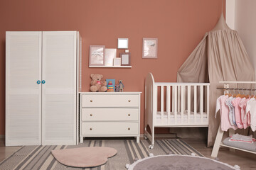 Baby room interior with stylish furniture and comfortable crib © New Africa