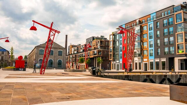Tallinn, Estonia - April 20 2021: Timelapse of the Port Noblessner on a sunny windy day. Modern district in Tallinn city center. 