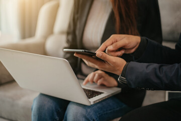 Group of financial advisors sitting at the table and listening to their manager during a meeting at office.