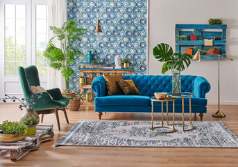 Blue wallpaper and sofa furniture style, decorative wooden palette bookshelf, gold lamp and middle...