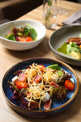 tuna salad with feta and tomatoes. table with food. dinner concept.